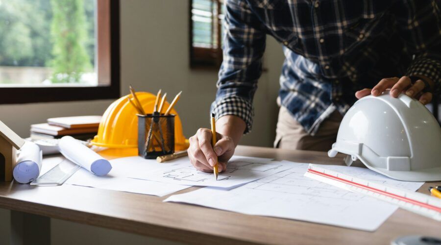 Engineer architect designer freelance work on start-up project drawing, construction plan